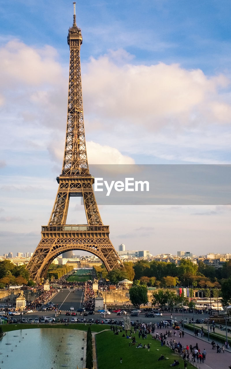 Eiffel tower against cloudy sky in paris. 