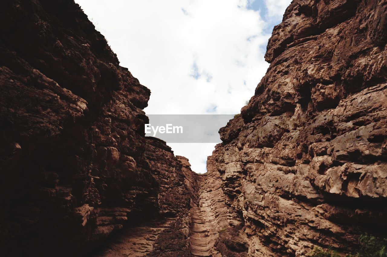 Low angle view of rocks against sky