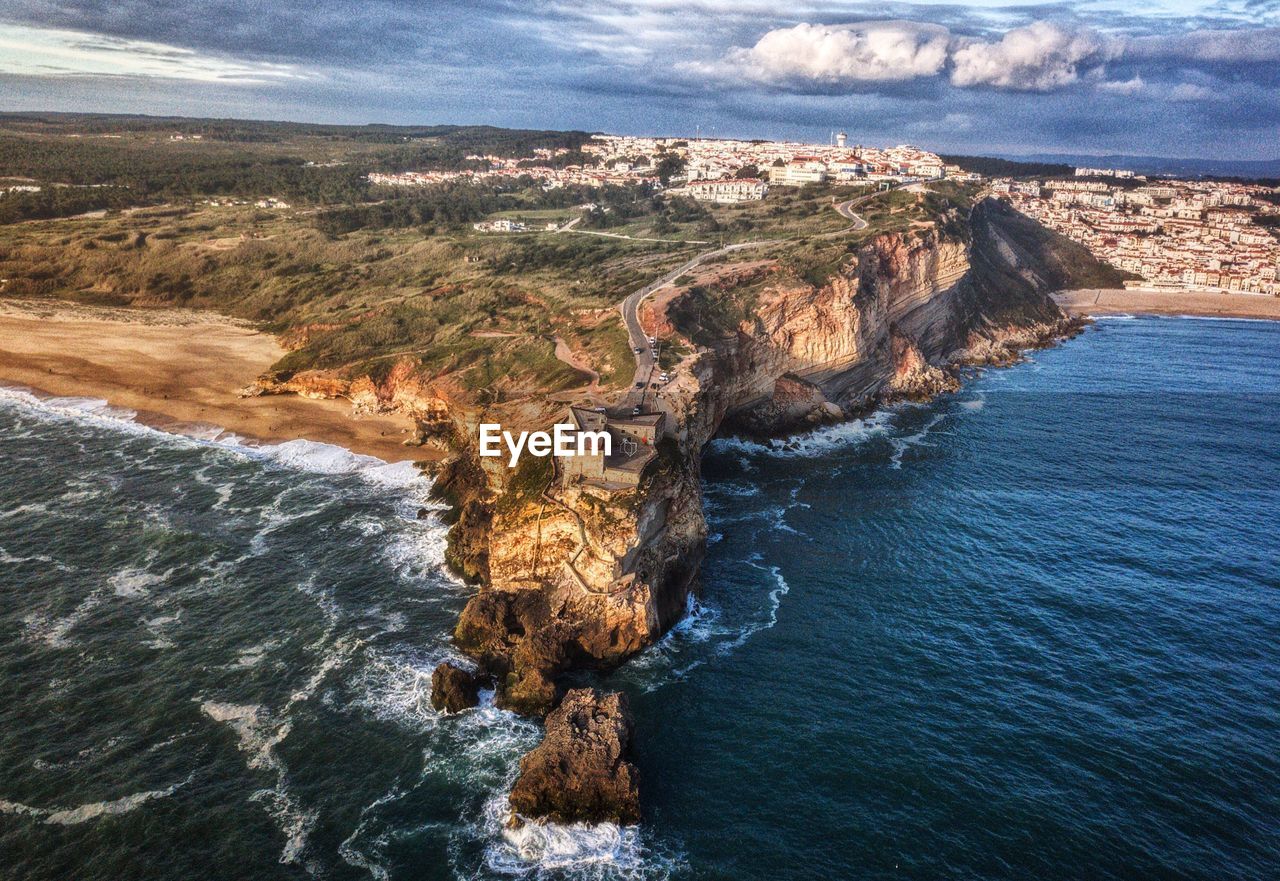 High angle view of sea shore against sky