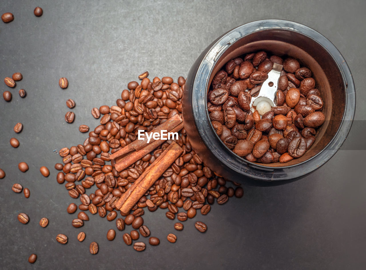 food and drink, food, studio shot, indoors, freshness, gray, high angle view, healthy eating, brown, roasted coffee bean, large group of objects, seed, still life, gray background, no people, wellbeing, ingredient, directly above, produce, abundance, coffee, spice, nut