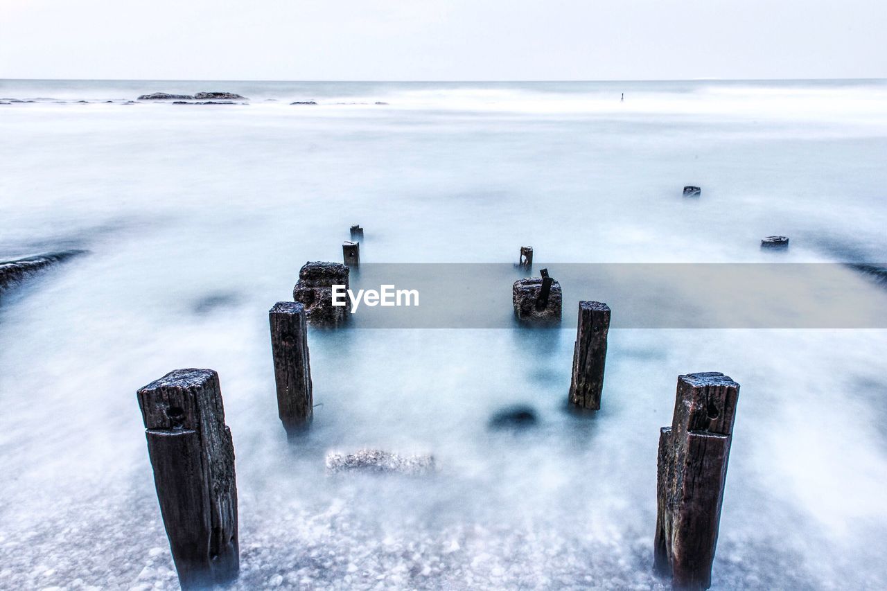 Scenic view of sea against sky during winter