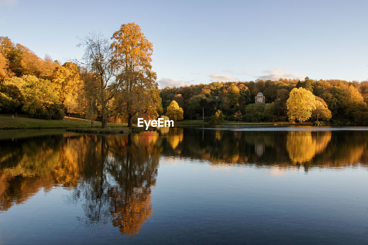 Scenic view of lake against sky during autumn