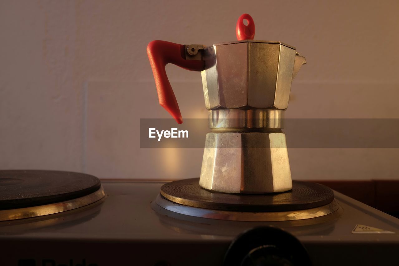 Close-up of espresso maker on burner