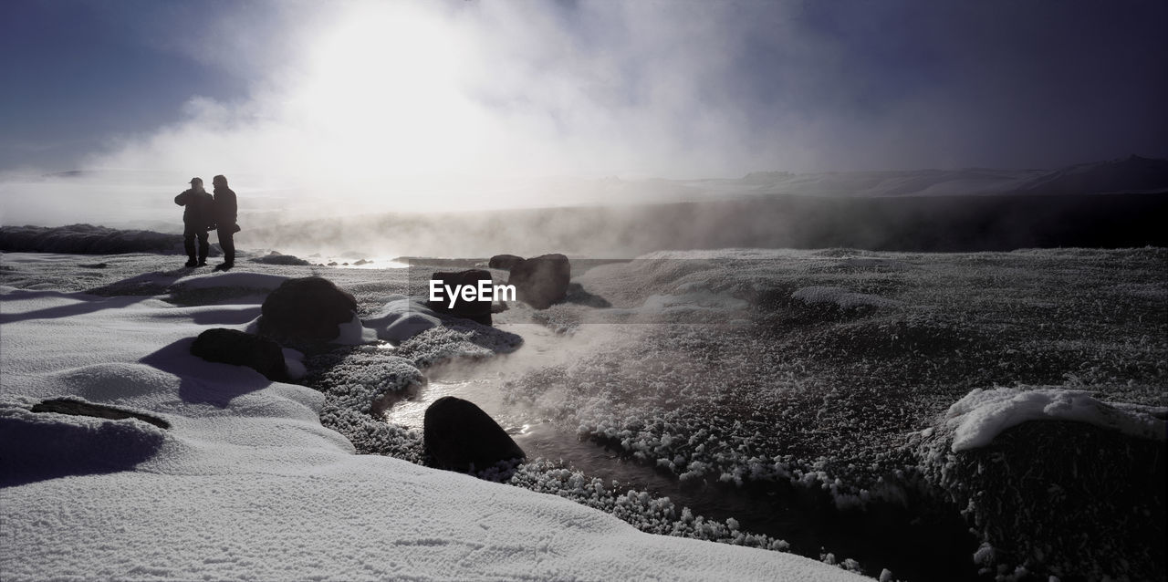 Steam rising from a geothermal river in the highlands of iceland