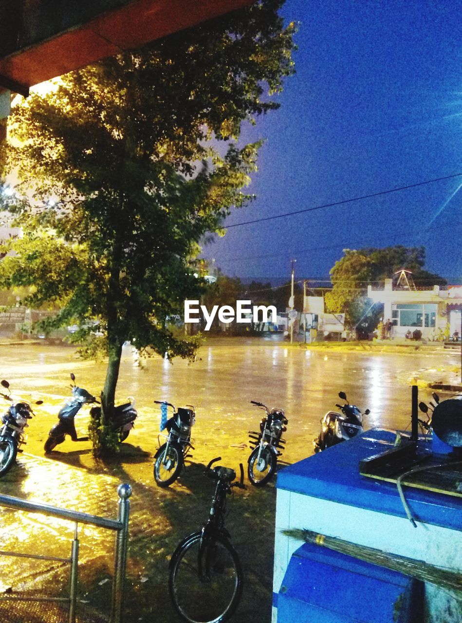 BICYCLES PARKED IN FRONT OF BUILDINGS