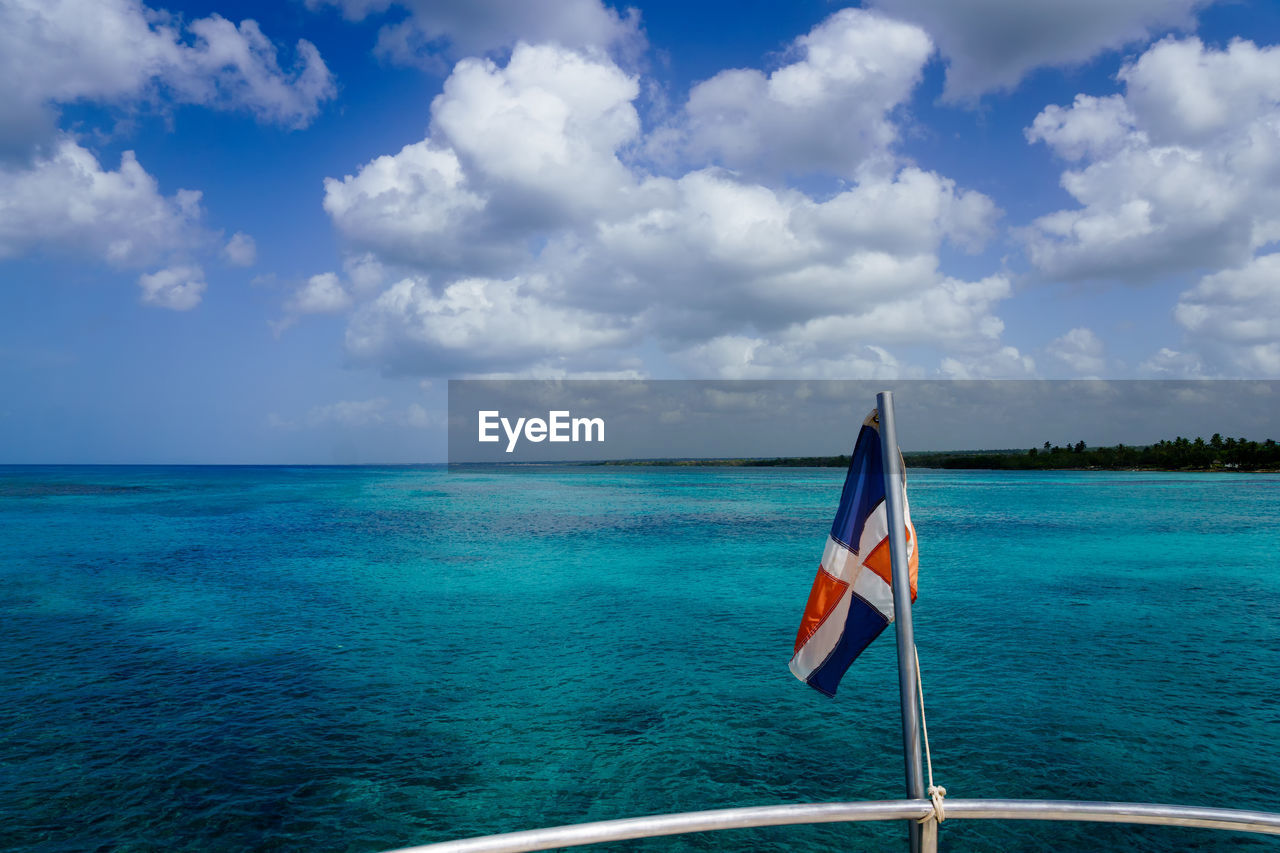 FLAG ON SEA AGAINST SKY