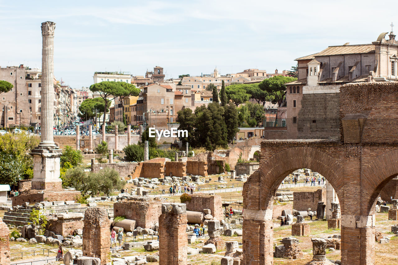 Old ruins at roman forum against sky