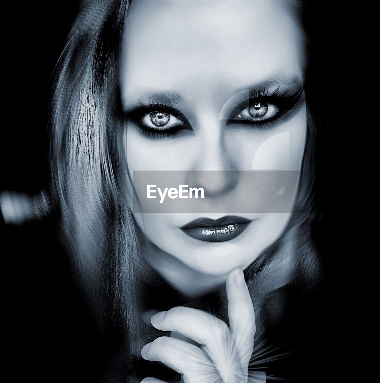 Close-up portrait of beautiful woman in darkroom