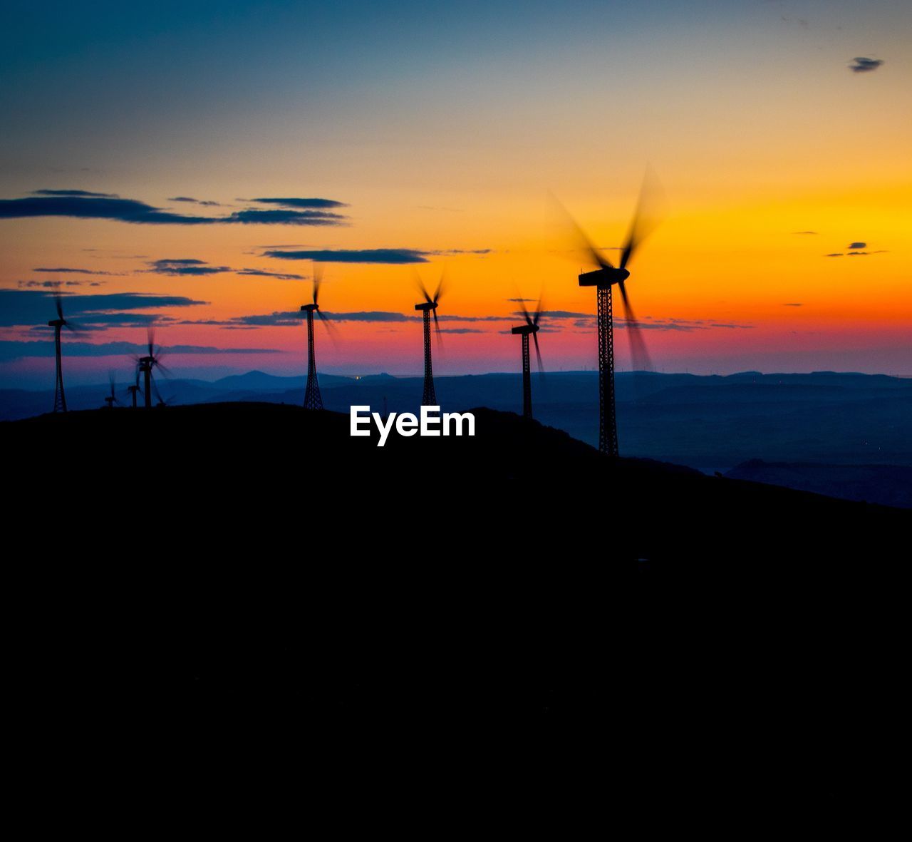 SILHOUETTE WINDMILL AGAINST SKY DURING SUNSET