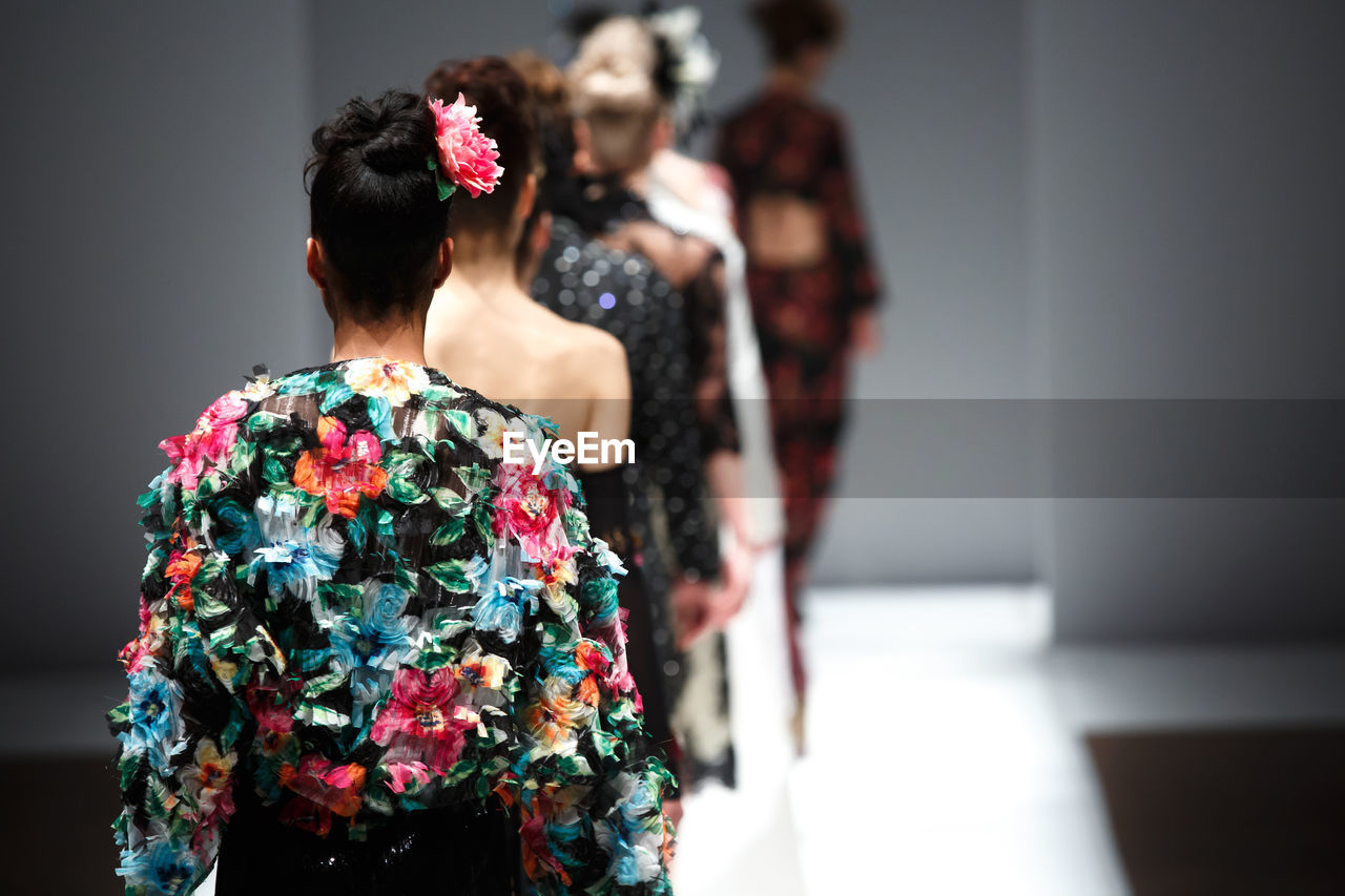 Rear view of models at fashion show