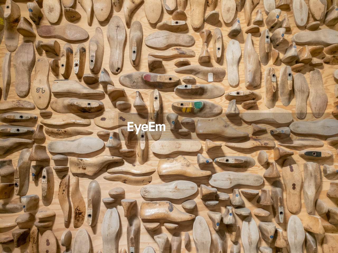 Full frame shot of shoe making carvings on wall