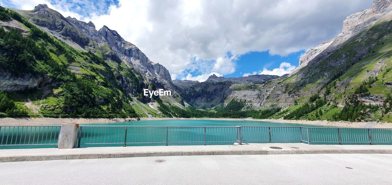 View of swimming pool with mountain in background