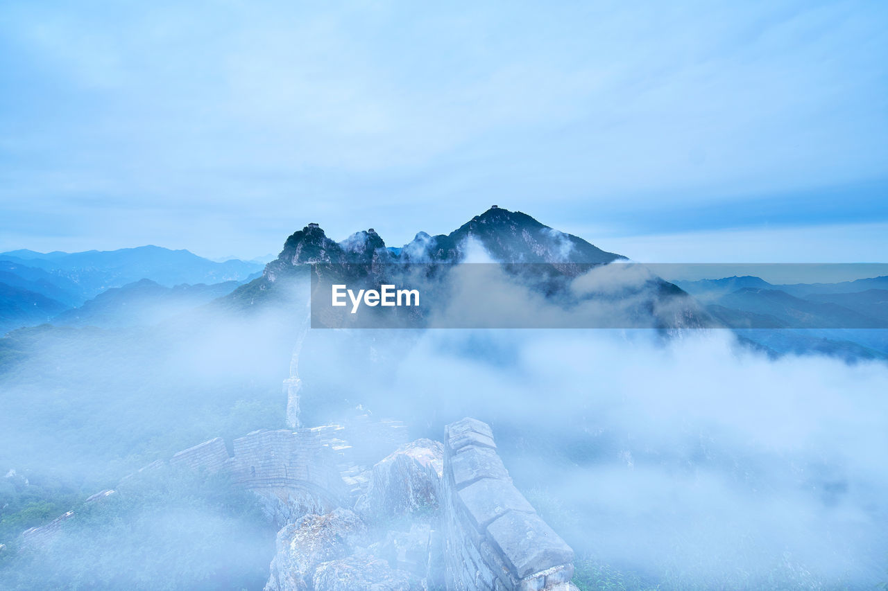 View of mountain range against cloudy sky