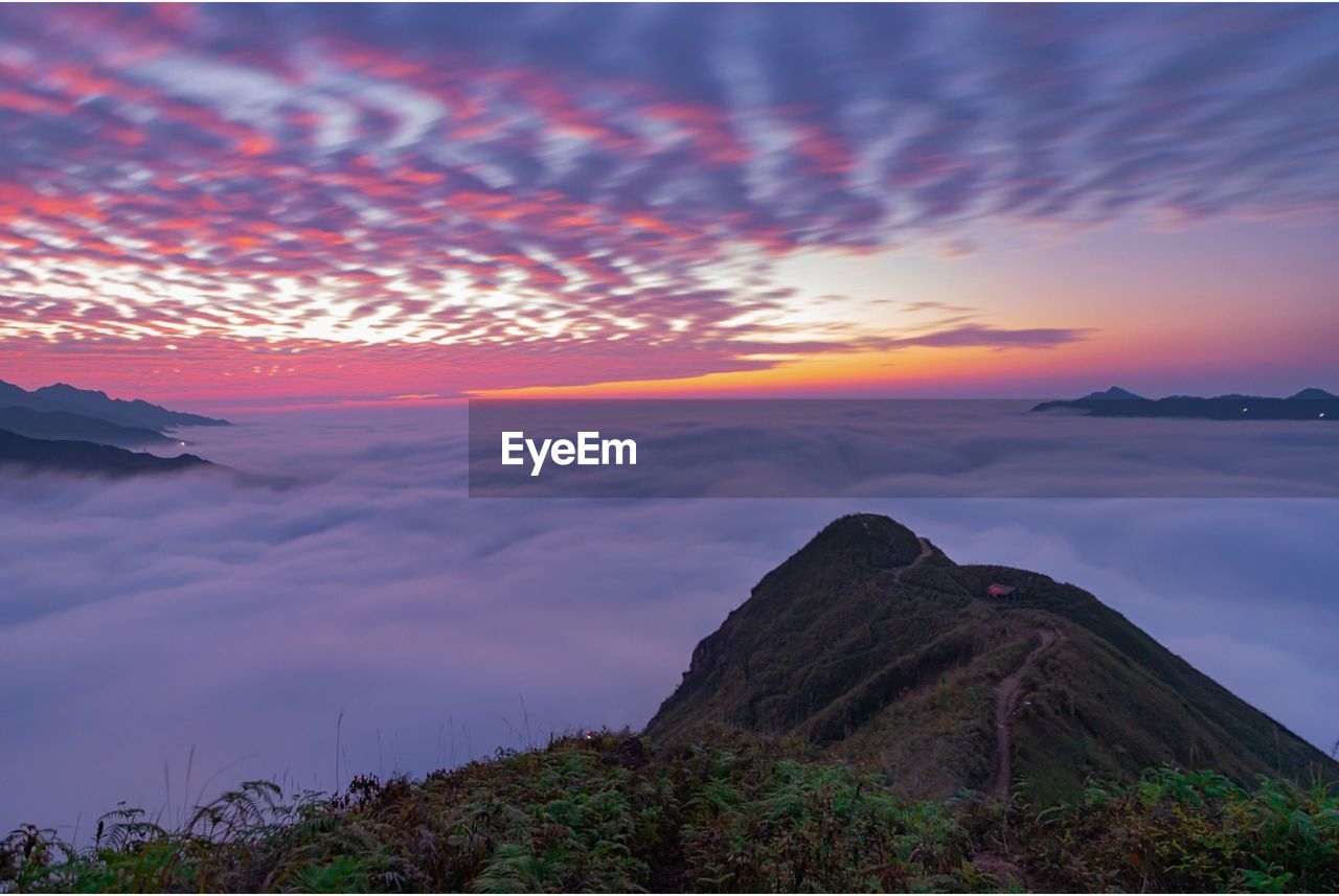scenic view of mountains against sky during sunset