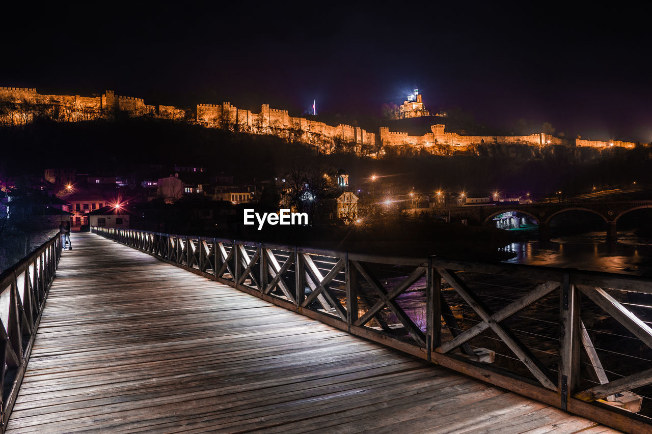 ILLUMINATED BRIDGE AT NIGHT