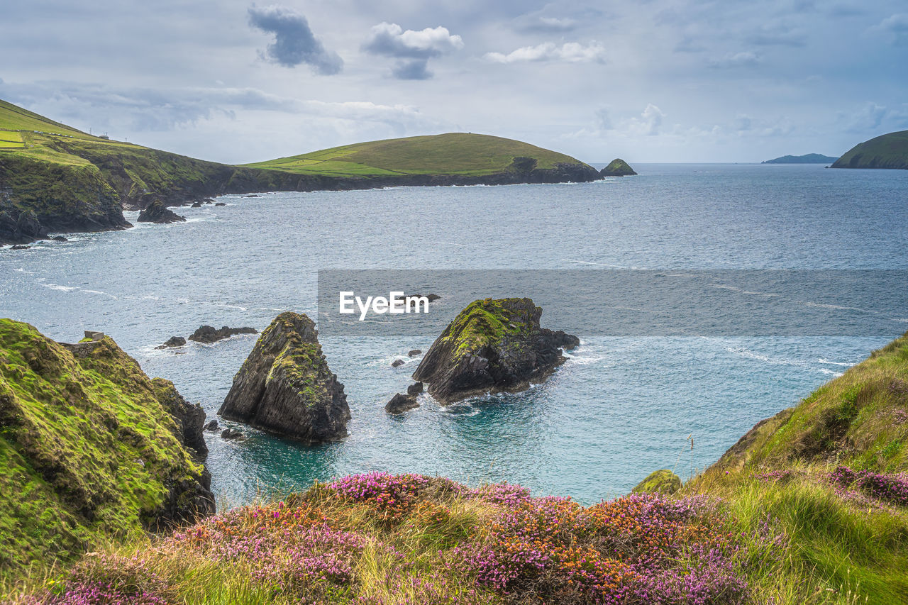 Islands at dunquin pier surrounded by turquoise water, dingle, wild atlantic way, kerry, ireland