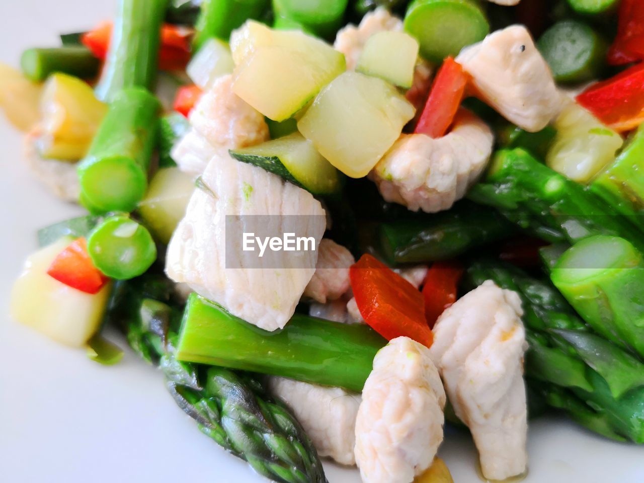 Close-up of turkey meat and chopped vegetables in plate