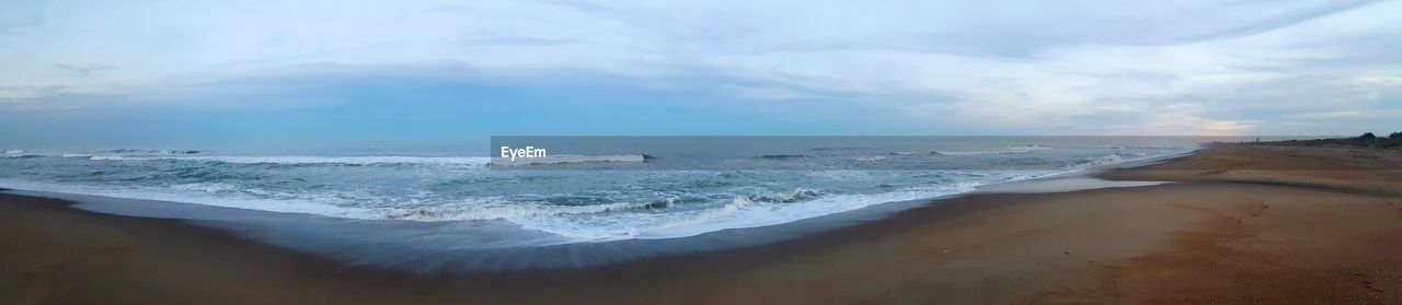 Panoramic view of beach against sky