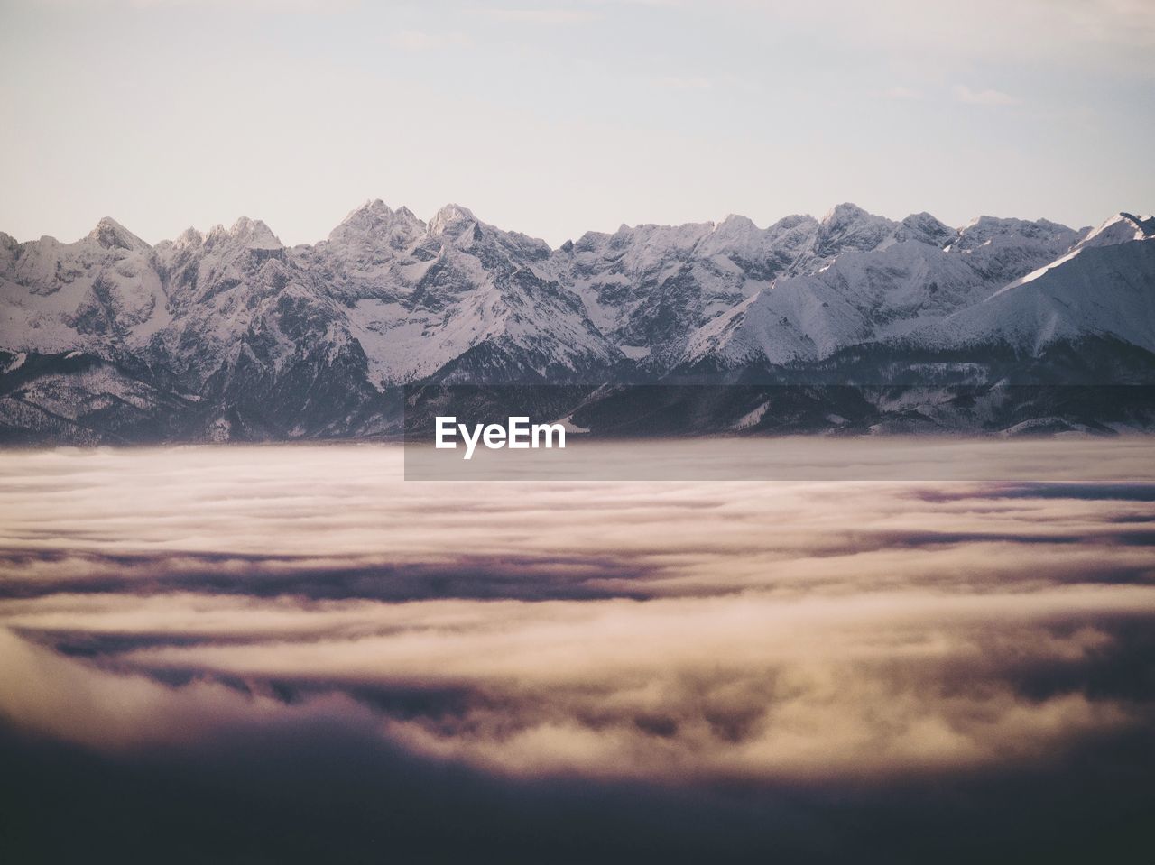 scenic view of snowcapped mountains against clear sky