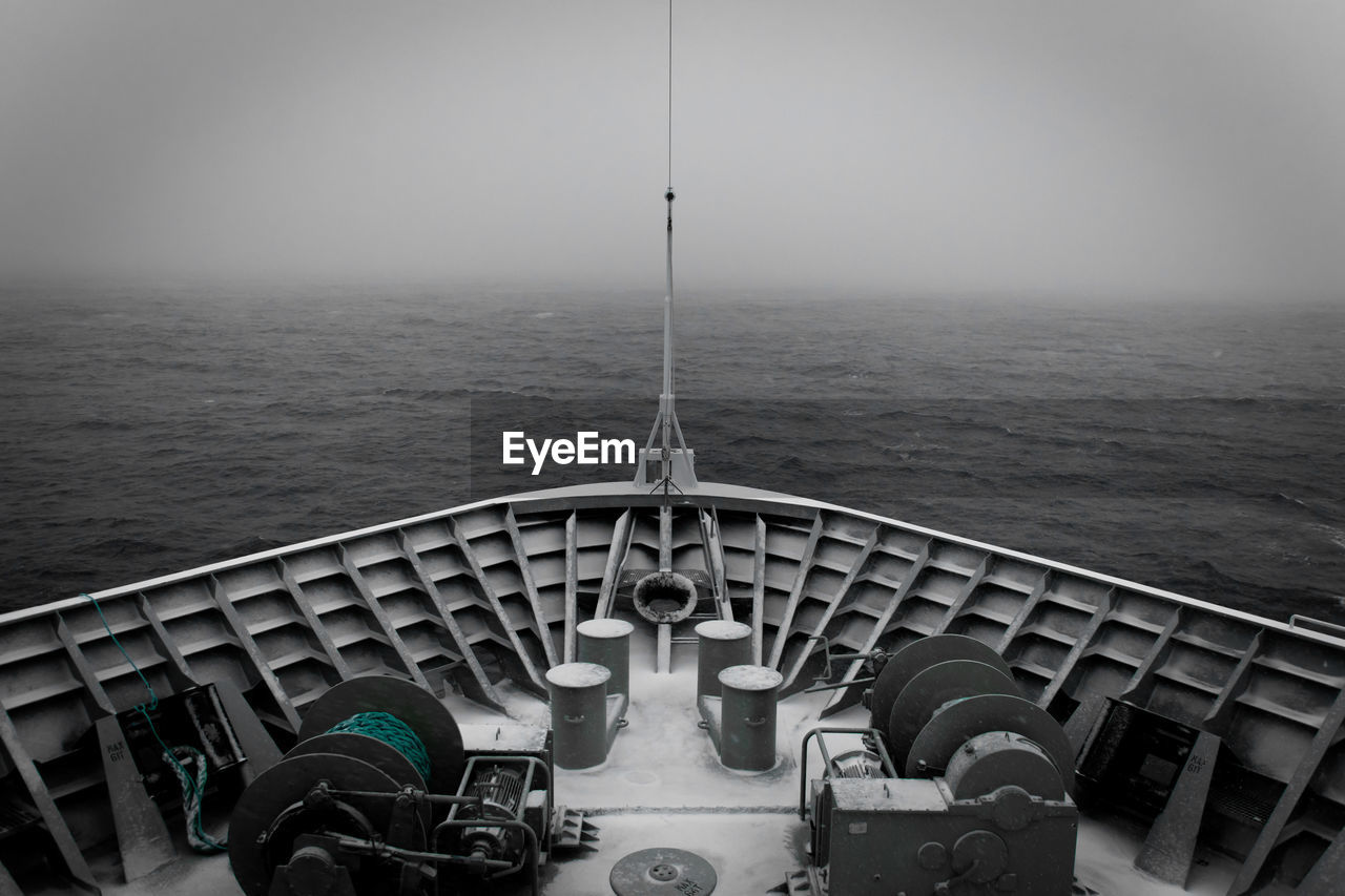 VIEW OF SHIP IN SEA AGAINST SKY