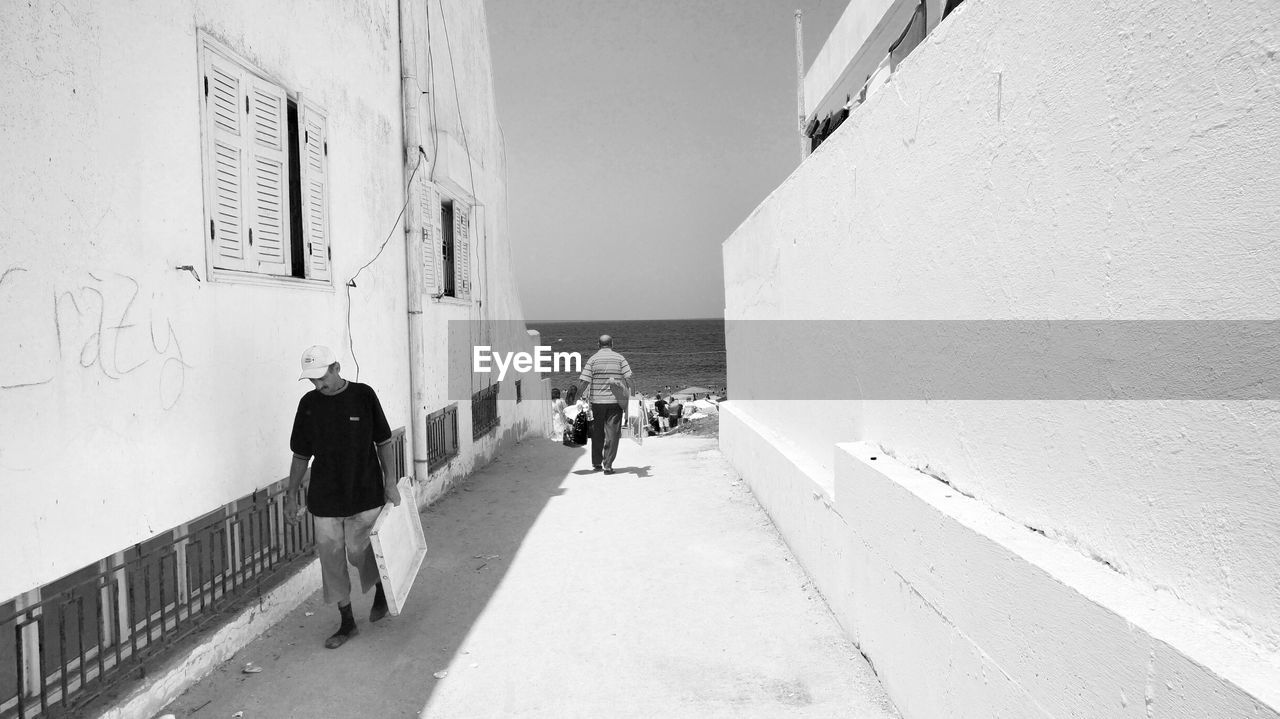 WOMAN WALKING ON ROAD