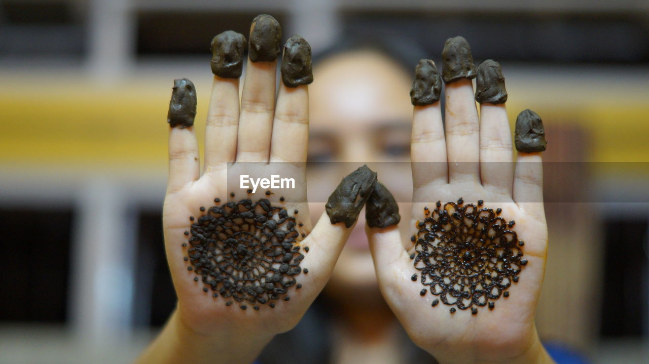 Close-up of hand with mehndi