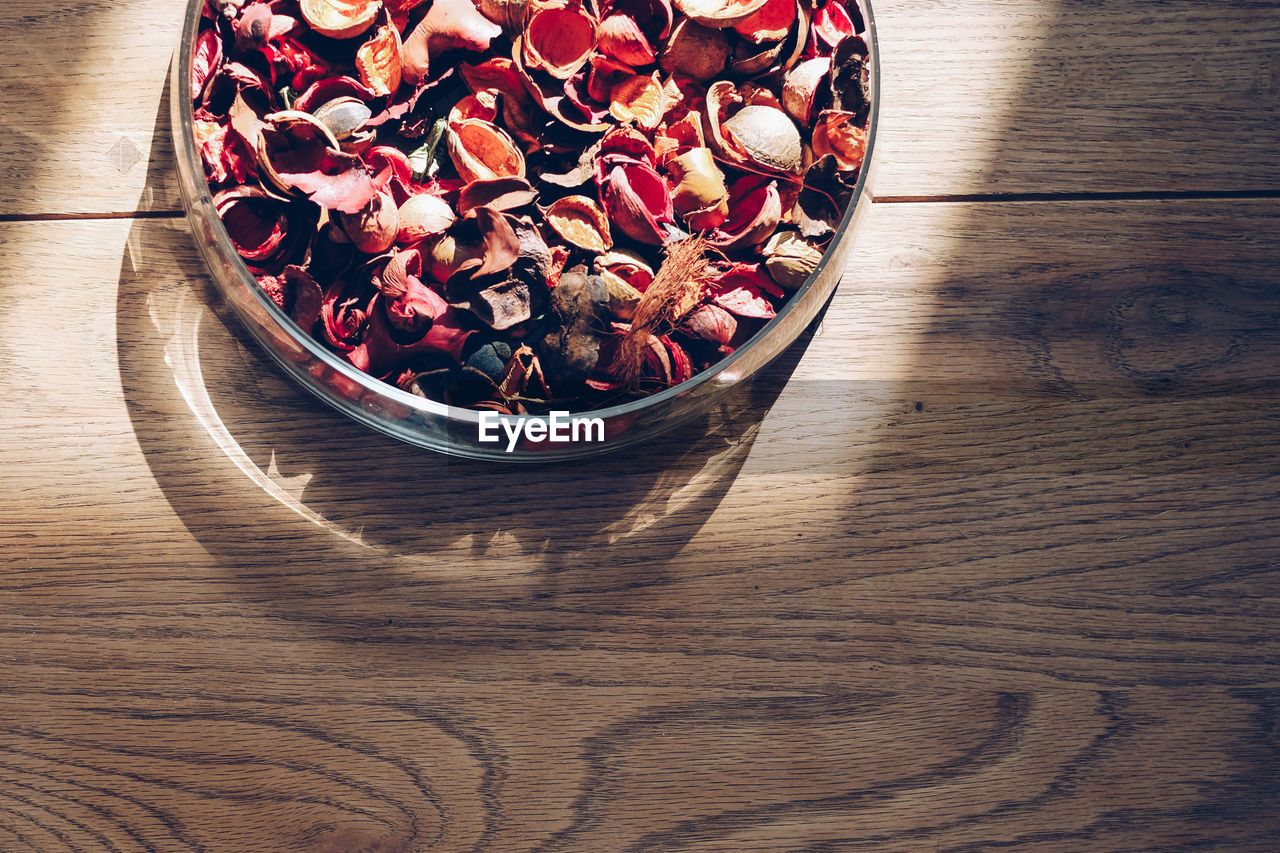 High angle view of nutshells in bowl on table