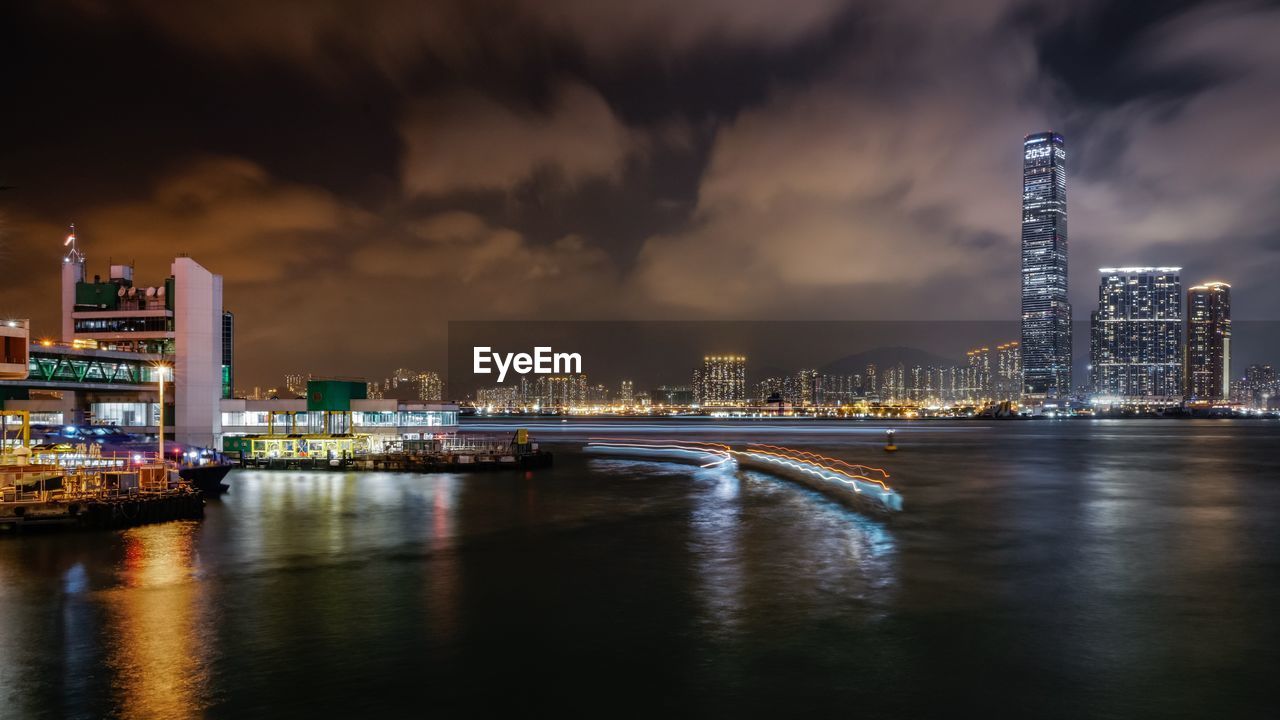 River with illuminated buildings in distance