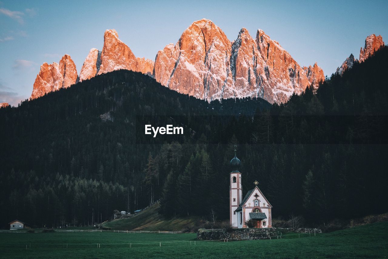 Church against forest and mountain