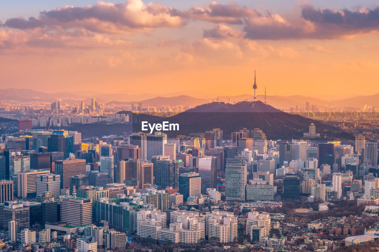 High angle view of city at sunset