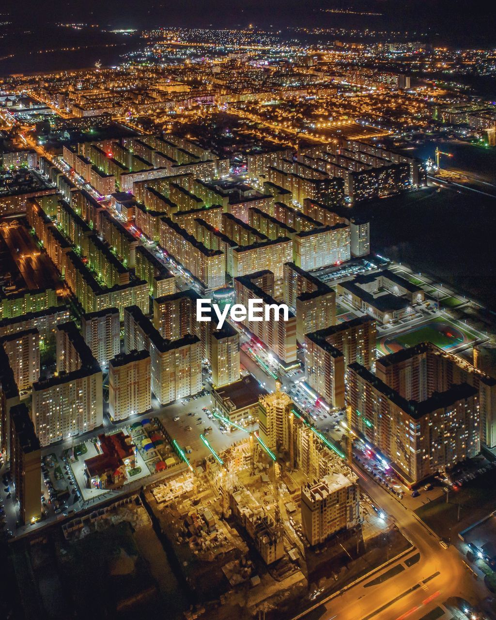 High angle view of illuminated buildings in city