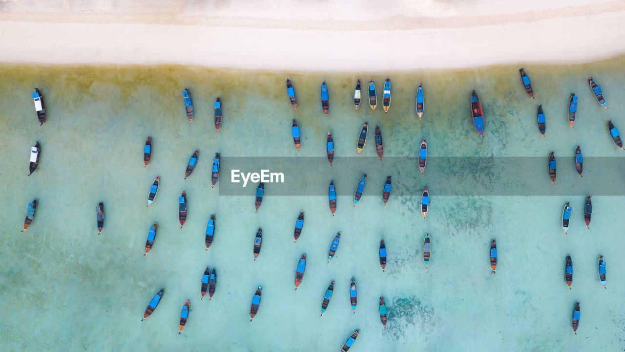 High angle view of nautical vessels moored on sea