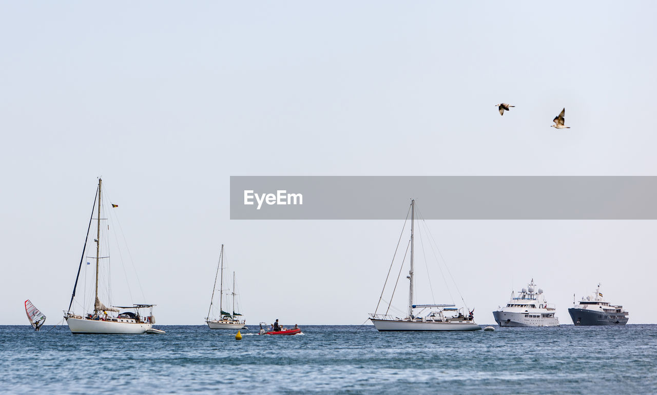 Boats sailing in sea