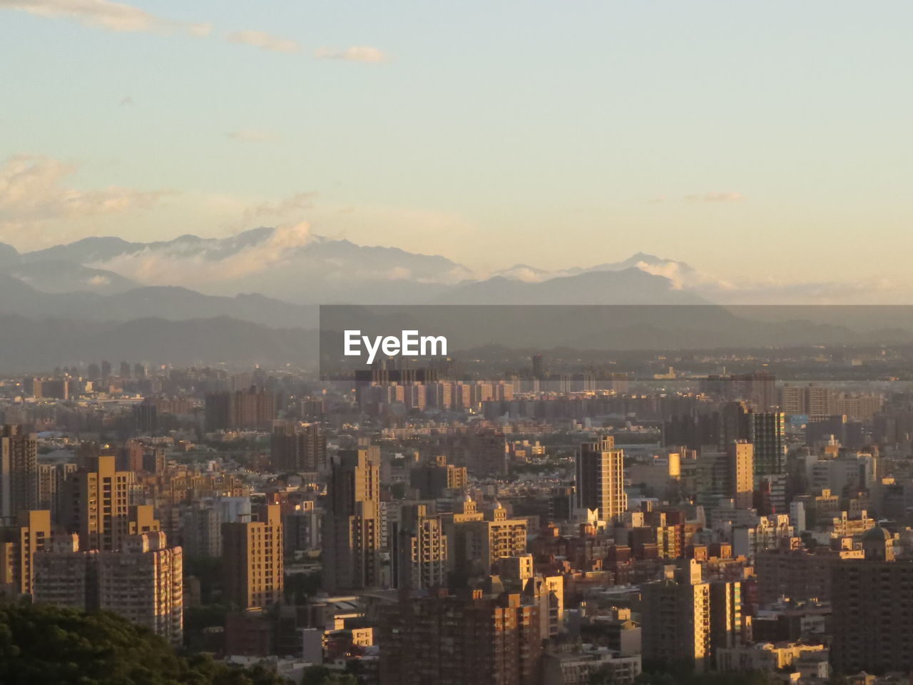High angle view of buildings in city against sky during sunset