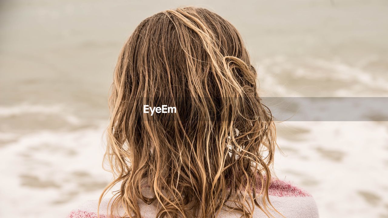 Rear view of girl on beach