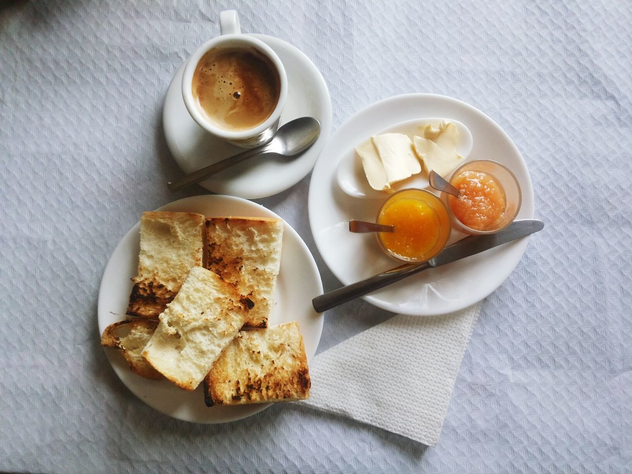 HIGH ANGLE VIEW OF BREAKFAST AND COFFEE ON TABLE