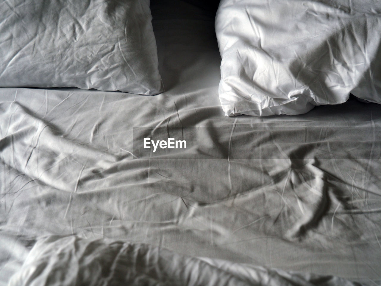 CLOSE-UP OF BED IN BLANKET