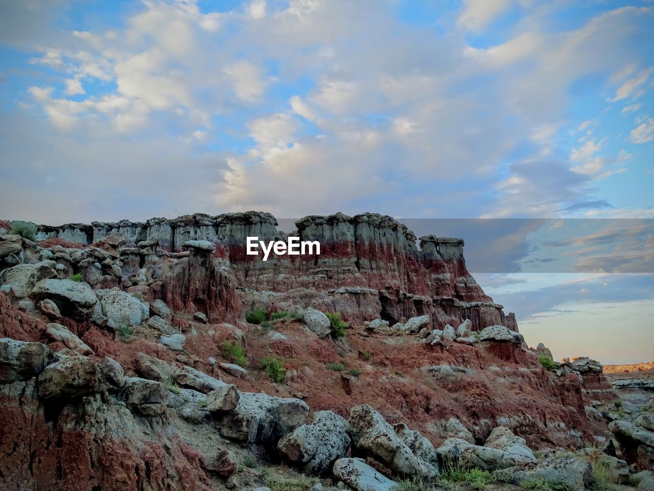 ROCK FORMATIONS ON CLIFF AGAINST SKY