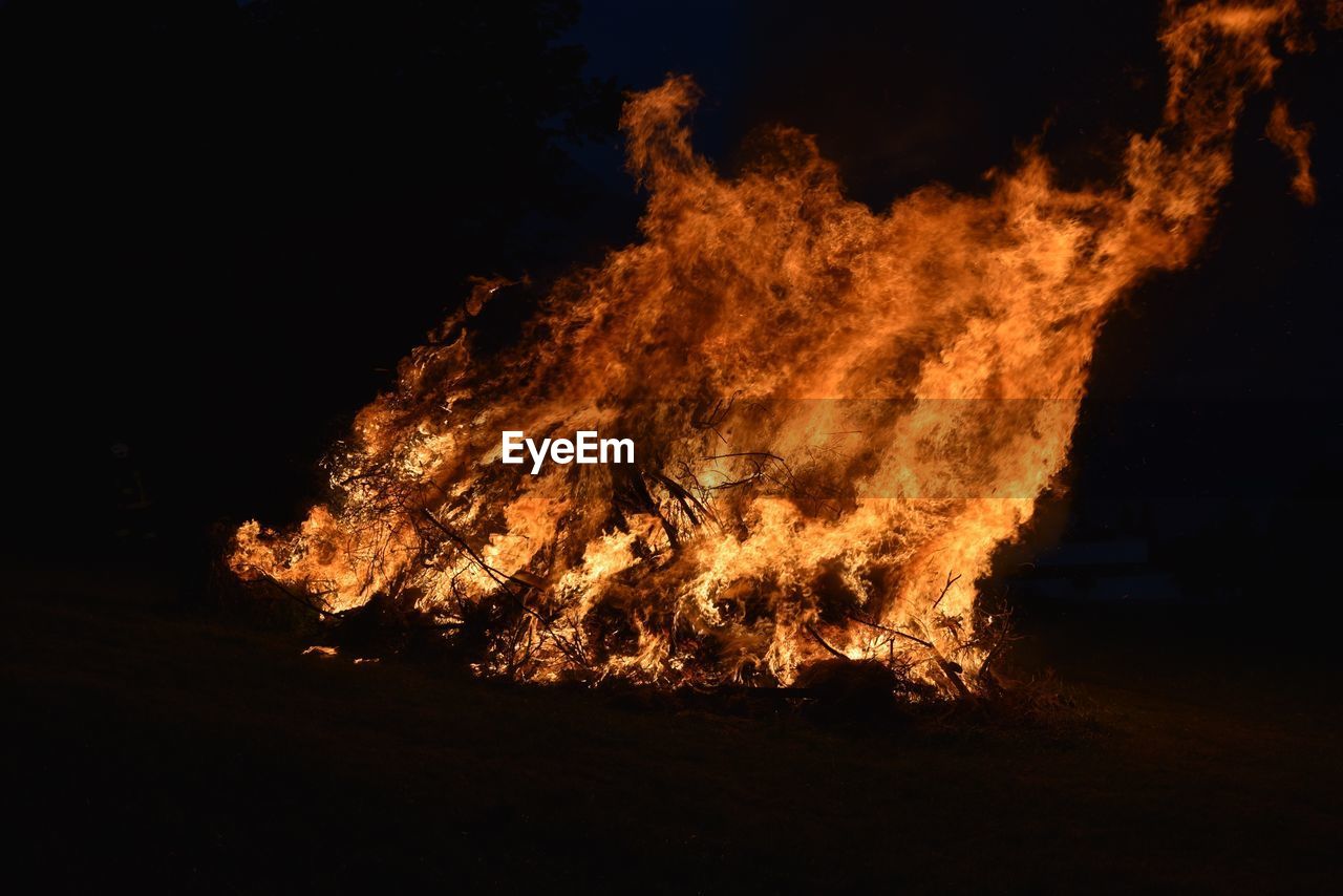 CLOSE-UP OF BONFIRE IN NIGHT