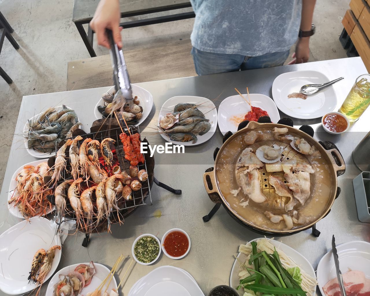 Midsection of man preparing food on table