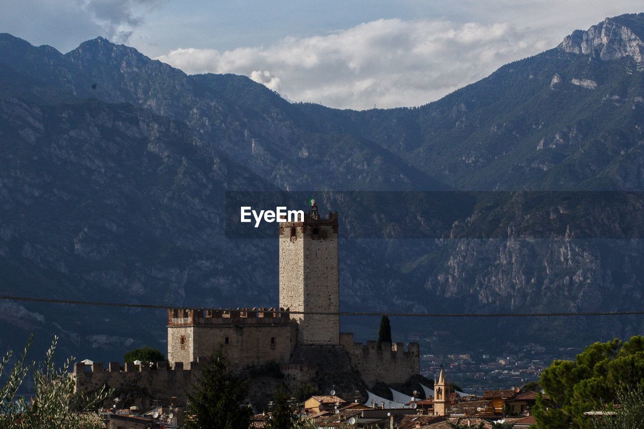 BUILDINGS AGAINST MOUNTAIN RANGE