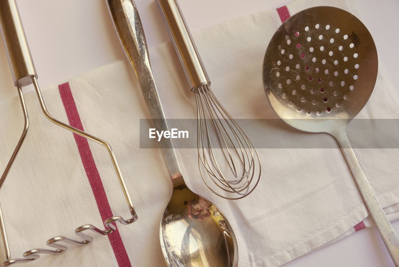 Close-up of kitchen utensils on napkin