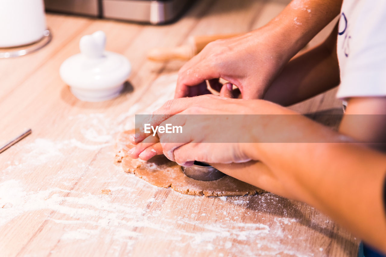 midsection of man preparing food on table