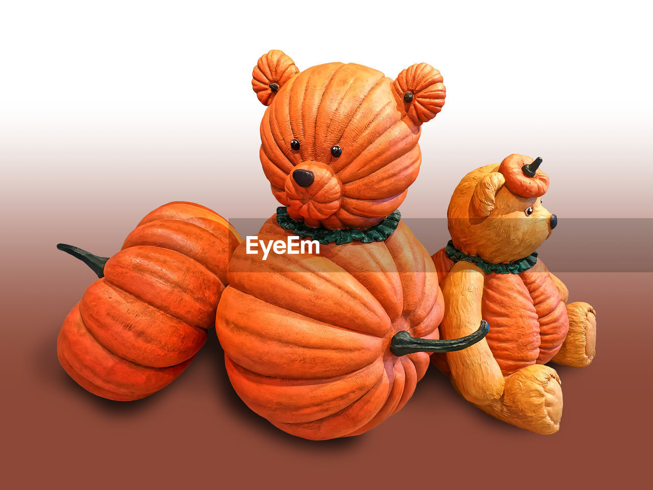 Close-up of pumpkin bear against white background