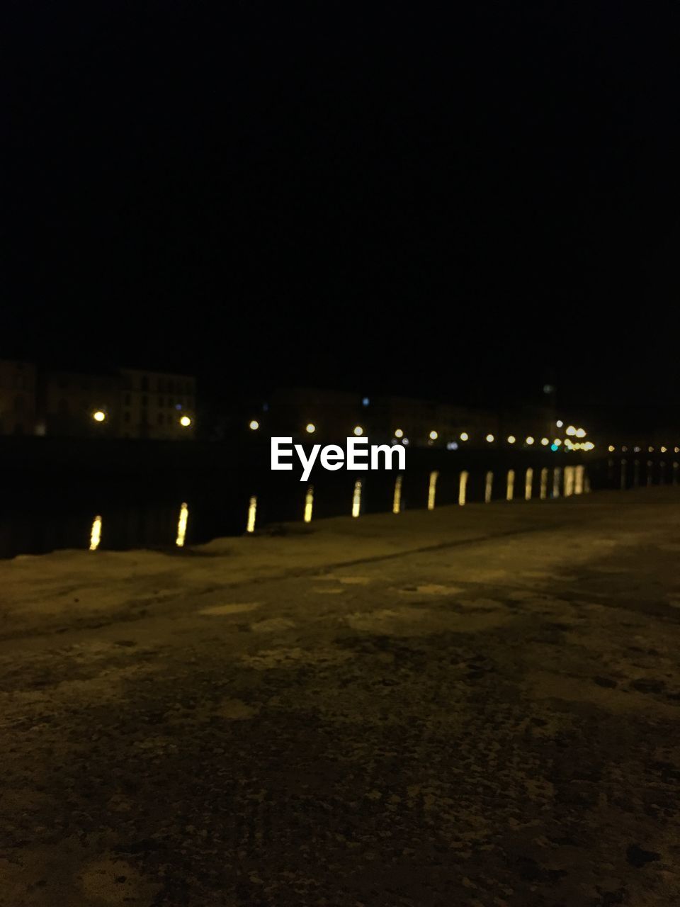 ILLUMINATED STREET LIGHTS AT NIGHT