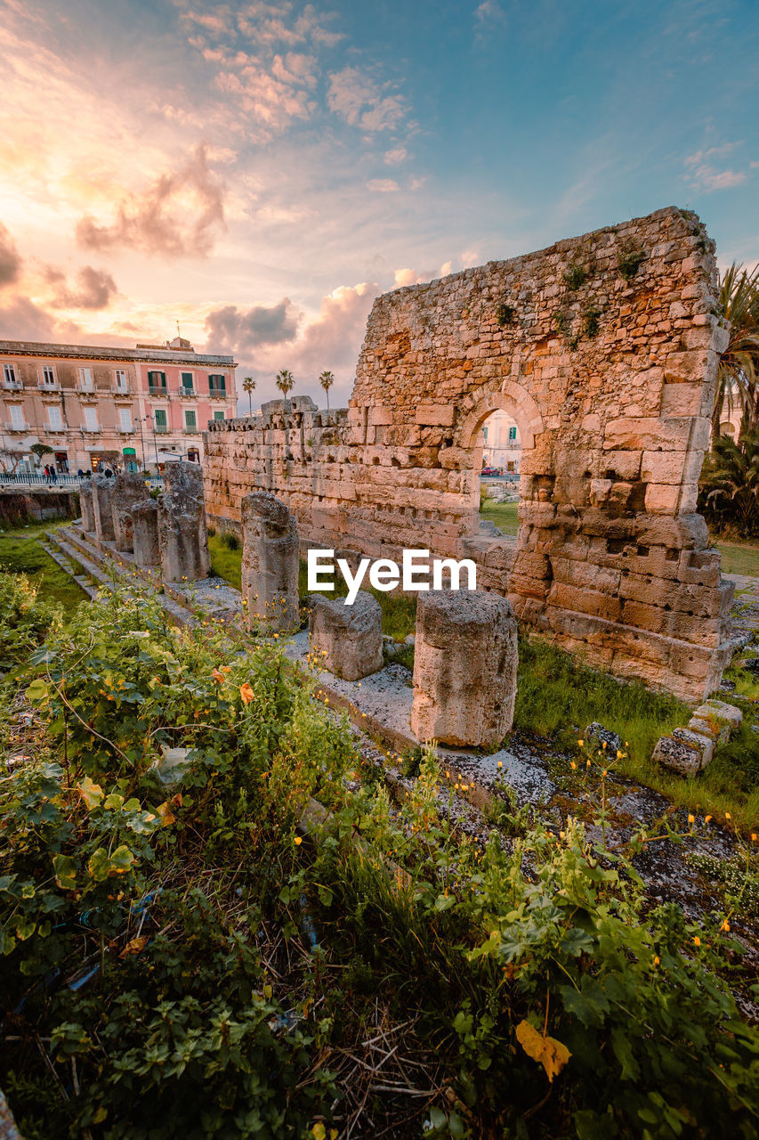 Temple of apollo in the centre of ortigia, syracuse at sunset