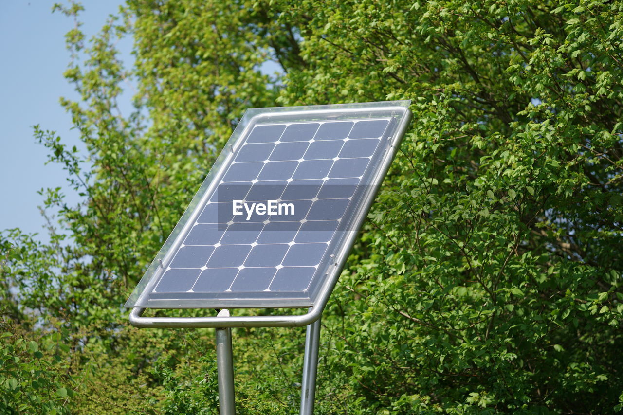 Solar panel against trees