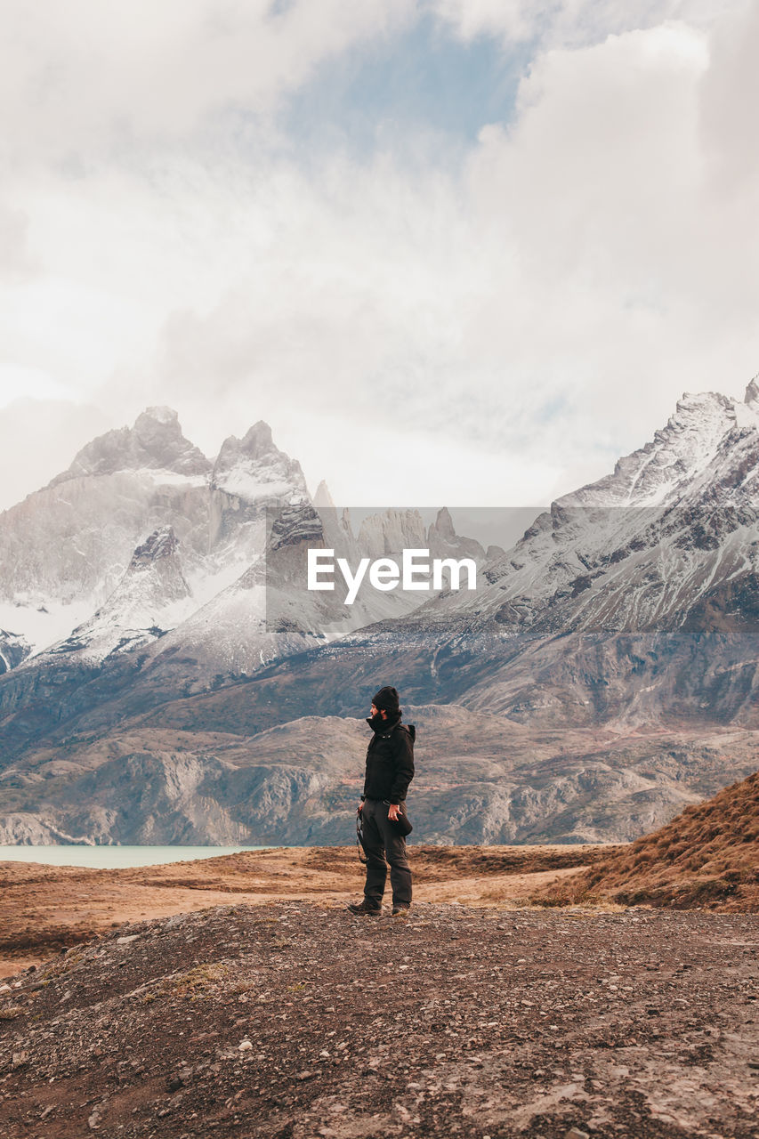 Man standing against mountains