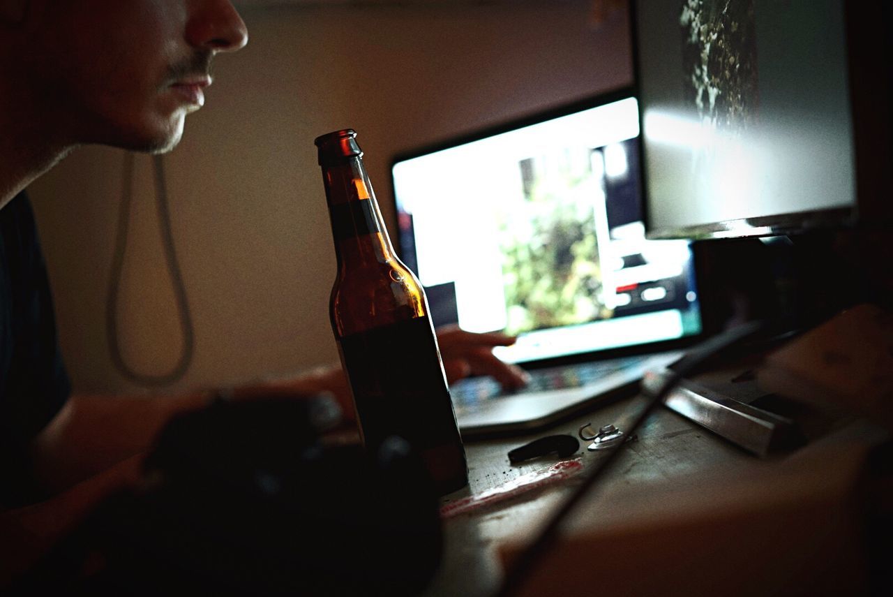 Cropped image of man working on laptop at home