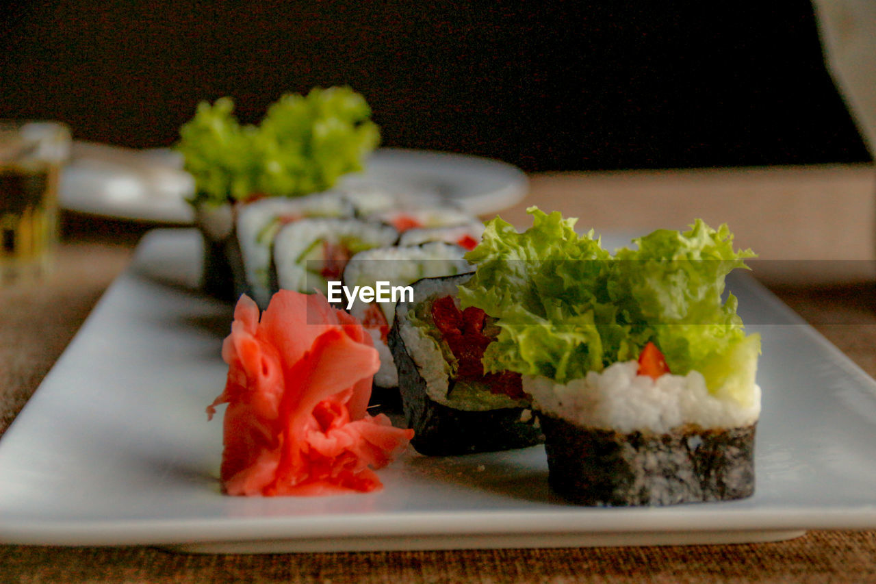 CLOSE-UP OF SUSHI SERVED IN PLATE